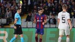 Slovak referee Ivan Kruzliak presents a yellow card to Barcelona's Spanish forward #07 Ferran Torres during the UEFA Champions League 1st round Group H football match between FC Barcelona and Shakhtar Donetsk at the Estadi Olimpic Lluis Companys in Barcelona on October 25, 2023. (Photo by LLUIS GENE / AFP)