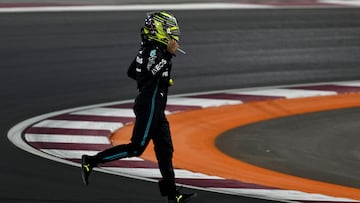 Formula One F1 - Qatar Grand Prix - Lusail International Circuit, Lusail, Qatar - October 8, 2023 Mercedes' Lewis Hamilton runs across the track after crashing out of the race REUTERS/Hamad I Mohammed