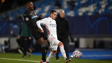 MADRID, SPAIN - DECEMBER 09: Lucas Vazquez of Real Madrid is challenged by Marcus Thuram of Borussia Monchengladbach during the UEFA Champions League Group B stage match between Real Madrid and Borussia Moenchengladbach at Estadio Alfredo di Stefano on De
