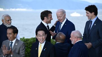 France's President Emmanuel Macron speaks with US President Joe Biden after a family photo of leaders of the G7 and invited countries during the G7 Leaders' Summit in Hiroshima on May 20, 2023. BRENDAN SMIALOWSKI/Pool via REUTERS