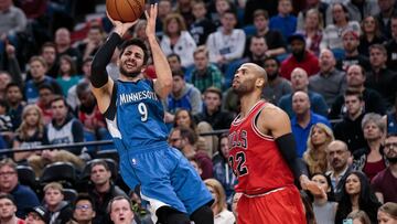 Feb 12, 2017; Minneapolis, MN, USA; Chicago Bulls forward Taj Gibson (22) fouls Minnesota Timberwolves guard Ricky Rubio (9) in the first quarter at Target Center. Mandatory Credit: Brad Rempel-USA TODAY Sports