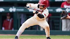 FAYETTEVILLE, ARKANSAS - APRIL 16: Zach Gregory #3 of the Arkansas Razorbacks bunts the ball during a game against the LSU Tigers at Baum-Walker Stadium at George Cole Field on April 16, 2022 in Fayetteville, Arkansas. The Razorbacks defeated the Tigers 6-2. (Photo by Wesley Hitt/Getty Images)