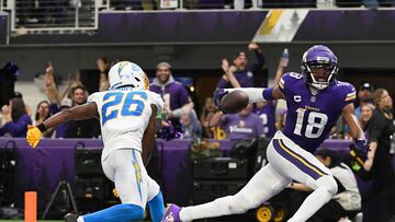 Asante Samuel Jr. #26 of the Los Angeles Chargers attempts to tackle Justin Jefferson #18 of the Minnesota Vikings