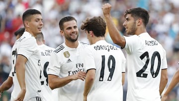 Aug 4, 2018; Landover, MD, USA; Real Madrid midfielder Marco Asensio (20) celebrates with teammates after scoring a goal against Juventus in the second half during an International Champions Cup soccer match at FedEx Field. Real Madrid won 3-1. Mandatory 
