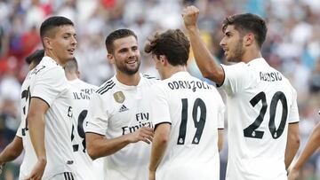 Aug 4, 2018; Landover, MD, USA; Real Madrid midfielder Marco Asensio (20) celebrates with teammates after scoring a goal against Juventus in the second half during an International Champions Cup soccer match at FedEx Field. Real Madrid won 3-1. Mandatory