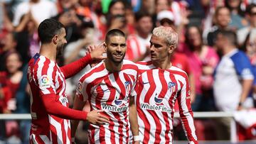 Atletico Madrid's Belgian midfielder Yannick Ferreira-Carrasco (C) celebrates with Atletico Madrid's Spanish defender Mario Hermoso (L) and Atletico Madrid's French forward Antoine Griezmann after scoring his team's first goal during the Spanish league football match between Club Atletico de Madrid and CA Osasuna at the Wanda Metropolitano stadium in Madrid on May 21, 2023. (Photo by Pierre-Philippe MARCOU / AFP)