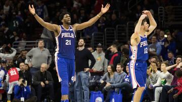 Jan 15, 2018; Philadelphia, PA, USA; Philadelphia 76ers center Joel Embiid (21) and guard T.J. McConnell (12) react to the crowd during the fourth quarter against the Toronto Raptors at Wells Fargo Center. Mandatory Credit: Bill Streicher-USA TODAY Sports