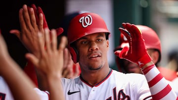 WASHINGTON, DC - JULY 13: Juan Soto #22 of the Washington Nationals celebrates with teammates after hitting a three run home run against the Seattle Mariners during the ninth inning of game one of a doubleheader at Nationals Park on July 13, 2022 in Washington, DC.   Scott Taetsch/Getty Images/AFP
== FOR NEWSPAPERS, INTERNET, TELCOS & TELEVISION USE ONLY ==