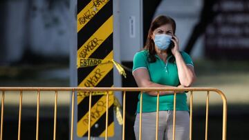 A relative talks on her cell phone outside the nursing home "Retirement House Luis Elizondo", where people have been infected by the coronavirus disease (COVID-19), in Guadalupe, on the outskirts of Monterrey, Mexico May 7, 2020. REUTERS/Daniel Becerril