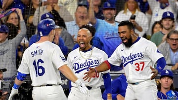 Oct 20, 2024; Los Angeles, California, USA; Los Angeles Dodgers catcher Will Smith (16) celebrates with outfielder Mookie Betts (50) and outfielder Teoscar Hernandez (37) after hitting a two run home run in the third inning against the New York Mets during game six of the NLCS for the 2024 MLB playoffs at Dodger Stadium. Mandatory Credit: Jayne Kamin-Oncea-Imagn Images TPX IMAGES OF THE DAY