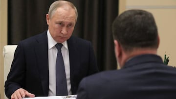 Russian President Vladimir Putin (L) meets Russia's Labour and Social Protection Minister Anton Kotyakov (R) at Novo-Ogaryovo residence, outside Moscow on May 4, 2022. (Photo by Mikhail Klimentyev / Sputnik / AFP)