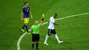 Soccer Football - World Cup - Group F - Germany vs Sweden - Fisht Stadium, Sochi, Russia - June 23, 2018 Germany's Jerome Boateng is shown a yellow card by referee Szymon Marciniak REUTERS/Hannah McKay