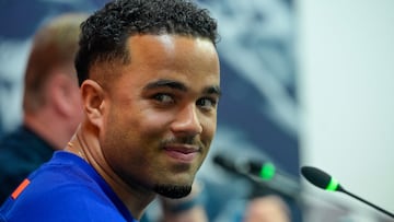 Netherlands' forward Justin Kluivert smiles during a press conference ahead of the UEFA Nations League quarter final second leg football match between Spain and Netherlands at the Mestalla stadium in Valencia, on March 22, 2025. (Photo by JOSE JORDAN / AFP)