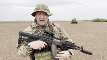 Yevgeny Prigozhin, chief of Russian private mercenary group Wagner, gives an address in camouflage and with a weapon in his hands in a desert area at an unknown location, in this still image taken from video possibly shot in Africa and published August 21, 2023. Courtesy PMC Wagner via Telegram via REUTERS ATTENTION EDITORS - THIS IMAGE WAS PROVIDED BY A THIRD PARTY. NO RESALES. NO ARCHIVES. MANDATORY CREDIT. TPX IMAGES OF THE DAY