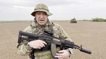 Yevgeny Prigozhin, chief of Russian private mercenary group Wagner, gives an address in camouflage and with a weapon in his hands in a desert area at an unknown location, in this still image taken from video possibly shot in Africa and published August 21, 2023. Courtesy PMC Wagner via Telegram via REUTERS ATTENTION EDITORS - THIS IMAGE WAS PROVIDED BY A THIRD PARTY. NO RESALES. NO ARCHIVES. MANDATORY CREDIT.     TPX IMAGES OF THE DAY