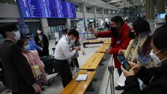 A Chinese family is reunited with their daughter, as a group of Chinese people are separated to go to the coronavirus disease (COVID-19) testing centre, upon their arrival at the Incheon International Airport in Incheon, South Korea, January 12, 2023. REUTERS/Kim Hong-Ji