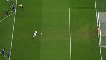 Argentina's forward #10 Lionel Messi (C) takes his penalty to score his team's first goal pass Croatia's goalkeeper #01 Dominik Livakovic (R) during the Qatar 2022 World Cup football semi-final match between Argentina and Croatia at Lusail Stadium in Lusail, north of Doha on December 13, 2022. (Photo by Jewel SAMAD / AFP) (Photo by JEWEL SAMAD/AFP via Getty Images)