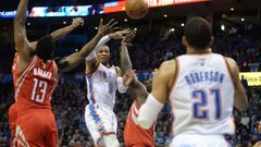 Dec 9, 2016; Oklahoma City, OK, USA; Oklahoma City Thunder guard Russell Westbrook (0) passes the ball to forward Andre Roberson (21) between Houston Rockets guard James Harden (13) and guard Patrick Beverley (2) during the fourth quarter at Chesapeake Energy Arena. Mandatory Credit: Mark D. Smith-USA TODAY Sports
