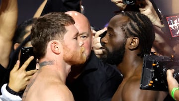 LAS VEGAS, NEVADA - SEPTEMBER 12: Canelo Alvarez (L) and Terence Crawford face off during a ceremonial weigh-in at T-Mobile Arena on September 12, 2025 in Las Vegas, Nevada. Alvarez and Crawford are scheduled to fight on�September 13, 2025, at Allegiant Stadium in Las Vegas. Steve Marcus/Getty Images/AFP (Photo by Steve Marcus / GETTY IMAGES NORTH AMERICA / Getty Images via AFP)