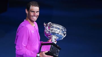 Spain&#039;s Rafael Nadal poses with the trophy after winning against Russia&#039;s Daniil Medvedev in their men&#039;s singles final match on day fourteen of the Australian Open tennis tournament in Melbourne early on January 31, 2022. (Photo by William 