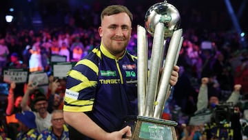 Darts - World Darts Championship - Alexandra Palace, London, Britain - January 3, 2026 Luke Littler poses with the trophy after winning the World Darts Championship Action Images via Reuters/Paul Childs