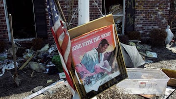 FILE PHOTO: A movie poster for "Gone with the Wind" sits in a front yard of a home damaged by Hurricane Katrina in Chalmette, Louisiana, in St. Bernard Parish September 28, 2005. REUTERS/Lee Celano/File Photo