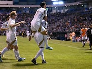 Los Angeles FC's Gabonese forward #99 Denis Bouanga (bottom) and Los Angeles FC's South Korean forward #07 Son Heung-Min celebrate after the CONCACAF Champions Cup quarterfinal football match between Mexico's Cruz Azul and US' Los AngelesFC (LAFC) at Cuauhtemoc stadium in Puebla, Mexico on April 14, 2026. (Photo by Yuri CORTEZ / AFP)