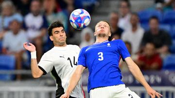 France's defender #03 Adrien Truffert controls the ball next to Egypt's midfielder #14 Ahmed Zizo the men's semi-final football match between France and Egypt during the Paris 2024 Olympic Games at the Lyon Stadium in Lyon on August 5, 2024. (Photo by Olivier CHASSIGNOLE / AFP)