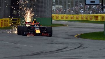 Sparks fly from the car as Red Bull's Dutch driver Max Verstappen takes takes part in the qualifying session for the Formula One Australian Grand Prix in Melbourne on March 25, 2017. / AFP PHOTO / SAEED KHAN / -- IMAGE RESTRICTED TO EDITORIAL USE - STRICTLY NO COMMERCIAL USE --