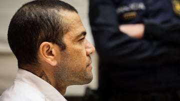 (FILES) Brazilian footballer Dani Alves looks on at the start of his trial at the High Court of Justice of Catalonia in Barcelona, on February 5, 2024. Ex-Brazil star Dani Alves has been sentenced to 4.5 years in jail for rape, Barcelona's court announced on February 22, 2024. (Photo by Jordi BORRAS / POOL / AFP)