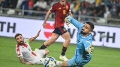 Georgia's Georgia's goalkeeper Giorgi Mamardashvili dives for the ball  during the UEFA Euro 2024 qualifying first round group A football match between Georgia and Spain in Tbilisi on September 8, 2023. (Photo by Vano SHLAMOV / AFP)