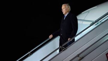 US President Joe Biden disembarks Air Force One at a military airport in Warsaw, Poland, on February 20, 2023.