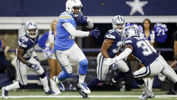 Nov 23, 2017; Arlington, TX, USA; Los Angeles Chargers wide receiver Keenan Allen (13) avoids the tackle of Dallas Cowboys cornerback Anthony Brown (30) and scores a touchdown in the fourth quarter at AT&T Stadium. Mandatory Credit: Tim Heitman-USA TODAY Sports