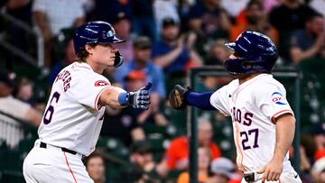 HOUSTON, TEXAS - JUNE 26: Jose Altuve #27 celebrates with Jake Meyers #6 of the Houston Astros after scoring in the fourth inning against the Colorado Rockies at Minute Maid Park on June 26, 2024 in Houston, Texas. Logan Riely/Getty Images/AFP (Photo by Logan Riely / GETTY IMAGES NORTH AMERICA / Getty Images via AFP)
