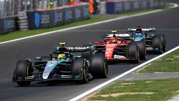 Formula One F1 - Italian Grand Prix - Autodromo Nazionale Monza, Monza, Italy - August 31, 2024 Mercedes' Lewis Hamilton, Ferrari's Carlos Sainz Jr. and Mercedes' George Russell during practice REUTERS/Massimo Pinca