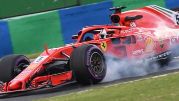 Ferrari's German driver Sebastian Vettel steers his car during the practice session of the Formula One Hungarian Grand Prix at the Hungaroring circuit in Mogyorod near Budapest, Hungary, on July 27, 2018. / AFP PHOTO / ATTILA KISBENEDEK