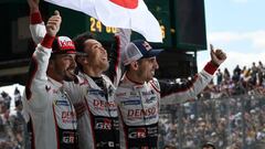 (From L) Spain&#039;s driver Fernando Alonso, Japanese&#039;s Kazuki Nakajima and Swiss&#039; Sebastien Buemi celebrate (Toyota TS050 Hybrid LMP1 N&deg;8) after winning the 86th Le Mans 24-hours endurance race, at the Circuit de la Sarthe on June 17, 2018