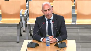 This screen grab obtained from a handout video published by the YouTube channel of the Spanish National court shows former president of the Spanish football federation Luis Rubiales, accused of sex assault and coercion over forcible kiss, taking the stand during his trial at the court of San Fernando de Henares, east of Madrid, on February 11, 2025. Spain's former football federation chief is to give his version of events in his trial over his forced kiss on player Jenni Hermoso. The 47-year-old provoked worldwide outrage after he cupped Hermoso's head and gave her an unsolicited kiss during the medal ceremony after Spain won the 2023 Women's World Cup in Australia. (Photo by Handout / SPANISH NATIONAL COURT / AFP) / RESTRICTED TO EDITORIAL USE - MANDATORY CREDIT "AFP PHOTO / SPANISH NATIONAL COURT " - NO MARKETING NO ADVERTISING CAMPAIGNS - DISTRIBUTED AS A SERVICE TO CLIENTS