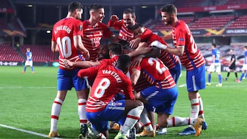 GRANADA, SPAIN - MARCH 11: Roberto Soldado of Granada CF celebrates with team mates after scoring their team&#039;s second goal during the UEFA Europa League Round of 16 First Leg match between Granada and Molde at Estadio Nuevo Los Carmenes on March 11, 