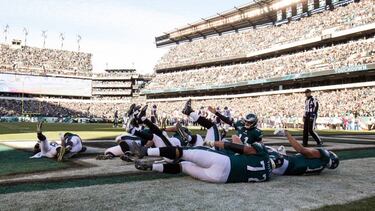 Nov 26, 2017; Philadelphia, PA, USA; Philadelphia Eagles quarterback Carson Wentz (11) and teammates perform a bowling celebration after a touchdown against the Chicago Bears during the second quarter at Lincoln Financial Field. Mandatory Credit: Bill Streicher-USA TODAY Sports