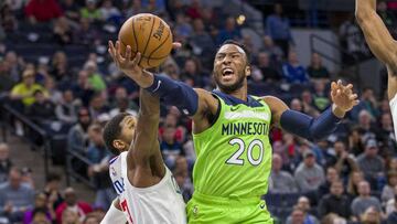 Feb 8, 2020; Minneapolis, Minnesota, USA; Minnesota Timberwolves guard Josh Okogie (20) drives to the basket and shoots the ball past LA Clippers forward Paul George (13) in the second half at Target Center. Mandatory Credit: Jesse Johnson-USA TODAY Sports