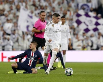 Valverde takes the ball past PSG's Marco Verratti in this week's Champions League clash.