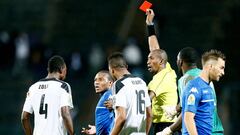 Referre Malang Diedhiou of Senegal gives Supersport United midfielder Thuso Phala (2nd L) a red card during the  CAF Confederation trophy final football match between Supersport United vs Mazembe at Lucas Moripe stadium in Atteridgeville on November 25, 2
