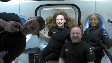 (FILES) In this file photo taken on September 16, 2021 courtesy of Inspiration4 shows the Inspiration4 crew (L-R) Jared Isaacman, Hayley Arceneaux, Christopher Sembroski and Sian Proctor in orbit. - The four private space tourists aboard a SpaceX capsule