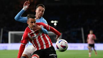 Celta Vigo's Spanish defender #22 Javier Manquillo (TOP) and Athletic Bilbao's Spanish forward #07 Alex Berenguer vie for the ball during the Spanish league football match between RC Celta de Vigo and Athletic Club Bilbao at the Balaidos stadium in Vigo on May 15, 2024. (Photo by MIGUEL RIOPA / AFP)