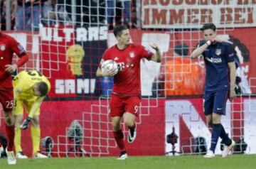 Eager to get another, Lewandowski picks the ball out of the net