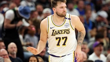 MINNEAPOLIS, MINNESOTA - APRIL 27: Luka Doncic #77 of the Los Angeles Lakers reacts to his three-point basket against the Minnesota Timberwolves in the second quarter of Game Four of the First Round of the 2025 NBA Playoffs at Target Center on April 27, 2025 in Minneapolis, Minnesota. NOTE TO USER: User expressly acknowledges and agrees that, by downloading and or using this photograph, User is consenting to the terms and conditions of the Getty Images License Agreement. David Berding/Getty Images/AFP (Photo by David Berding / GETTY IMAGES NORTH AMERICA / Getty Images via AFP)