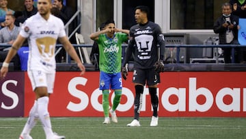 Seattle Sounders forward Raul Ruidiaz (9) wipes his eyes after scoring a goal as Pumas UNAM goalkeeper Alfredo Talavera looks on during the second leg CONCACAF Champions League final match between Seattle Sounders and Pumas UNAM at Lumen Field in Seattle, Washington on May 4, 2022. (Photo by Jason Redmond / AFP)