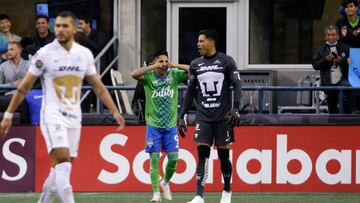 Seattle Sounders forward Raul Ruidiaz (9) wipes his eyes after scoring a goal as Pumas UNAM goalkeeper Alfredo Talavera looks on during the second leg CONCACAF Champions League final match between Seattle Sounders and Pumas UNAM at Lumen Field in Seattle, Washington on May 4, 2022. (Photo by Jason Redmond / AFP)