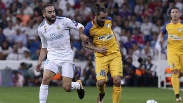 GRA510. MADRID, 13/09/2017.- El defensa del Real Madrid, Daniel Carvajal (i) y el centrocampista chipriota del Apoel, Efstathios Aloneftis durante el partido de Liga de Campeones que disputan en el estadio Santiago Bernabéu de Madrid. EFE/Kiko Huesca